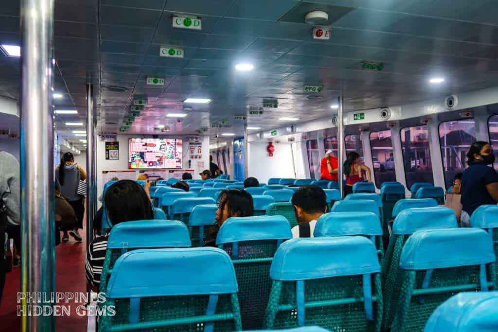 A couple of passengers inside a ferry.
