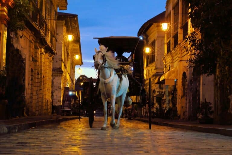 Horse-drawn carriage on the cobblestone streets of Vigan City at dusk – a cultural treasure among the Hidden Gems of Luzon.