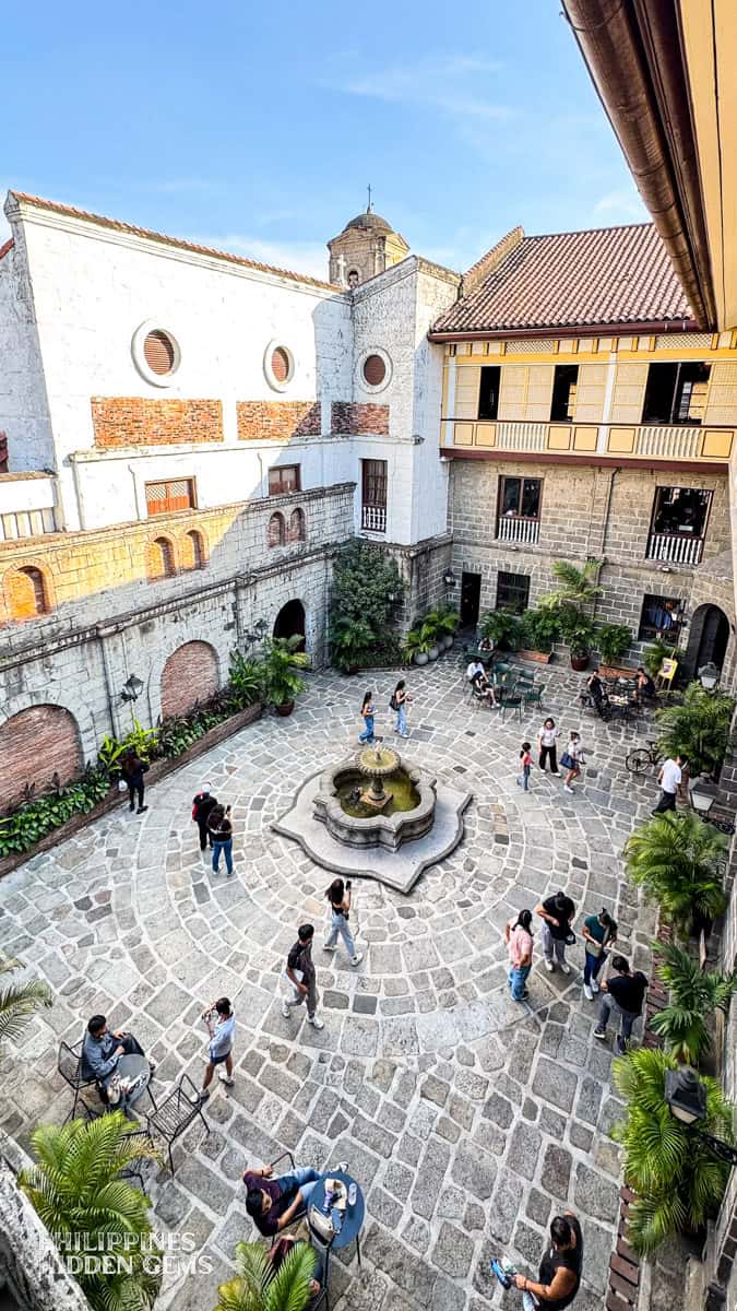 The courtyard with a fountain of an old building in Intramuros, Manila.