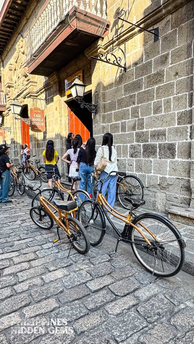 Bicycles with bamboo parts parked on a cobblestone street of Intramuros, Manila.