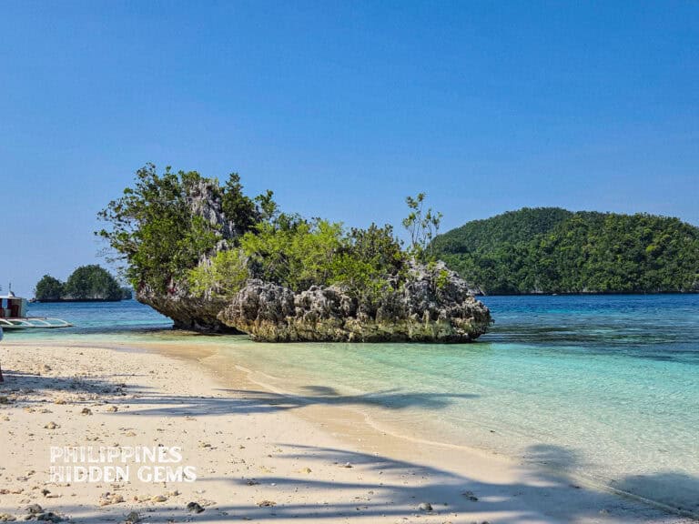 Pangabangan Beach, Dinagat Island with the view of surrounding islets and clear sea.