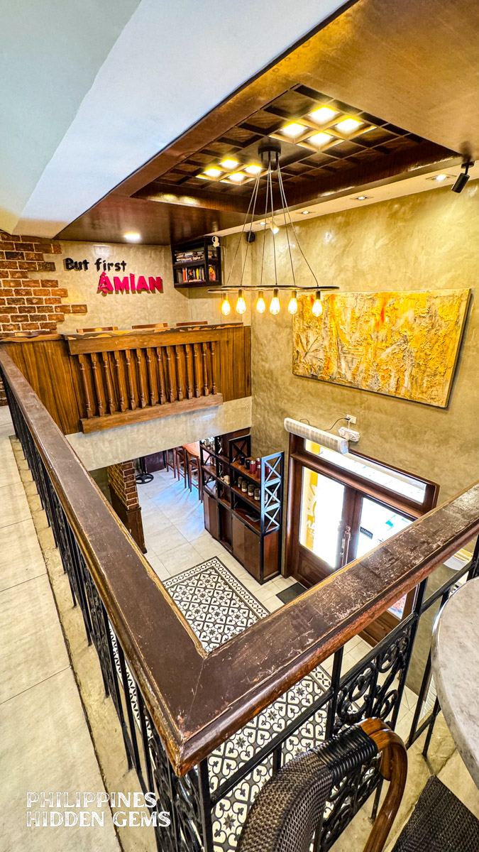The mezzanine of a cafe with Philippine Spanish colonial era design.