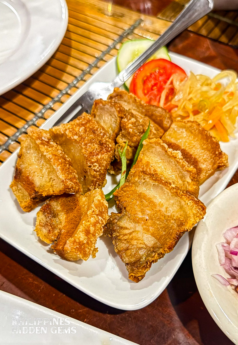 A plate of bagnet, fried pork dish.