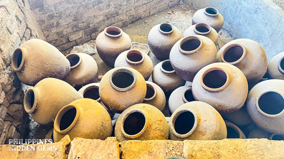 A pile of traditional Filipino earthenware burnay jars in Vigan, Philippines.