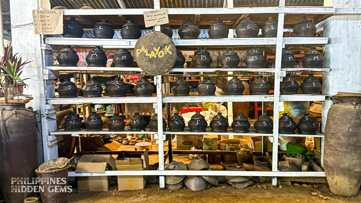 Shelves of Filipino palayok or cooking pot.