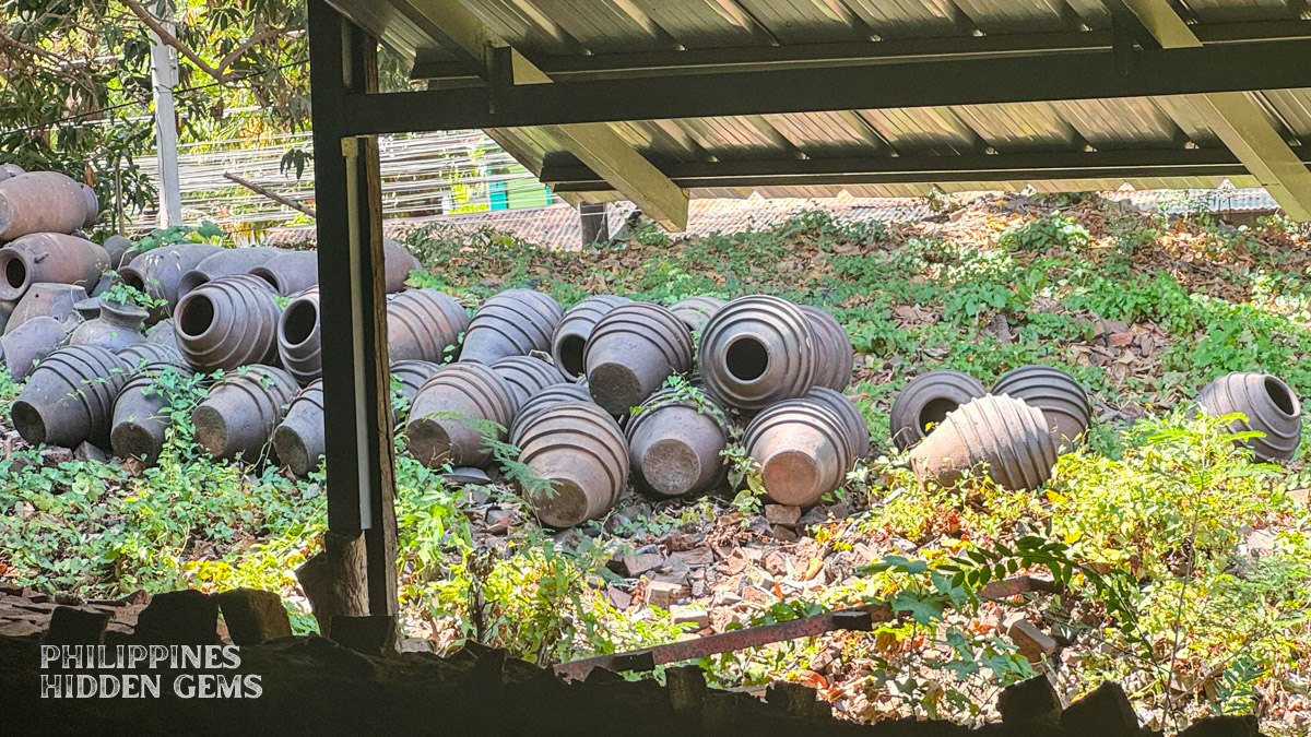 Layered pottery pieces sitting outdoors.