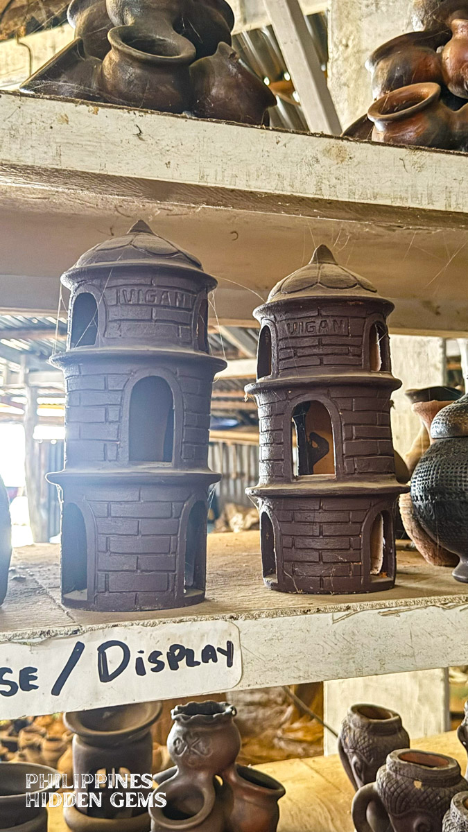 Earthenware miniature displays of bell towers.