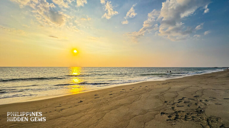 Sunset that casts a golden light in the sky at a beach in Vigan.